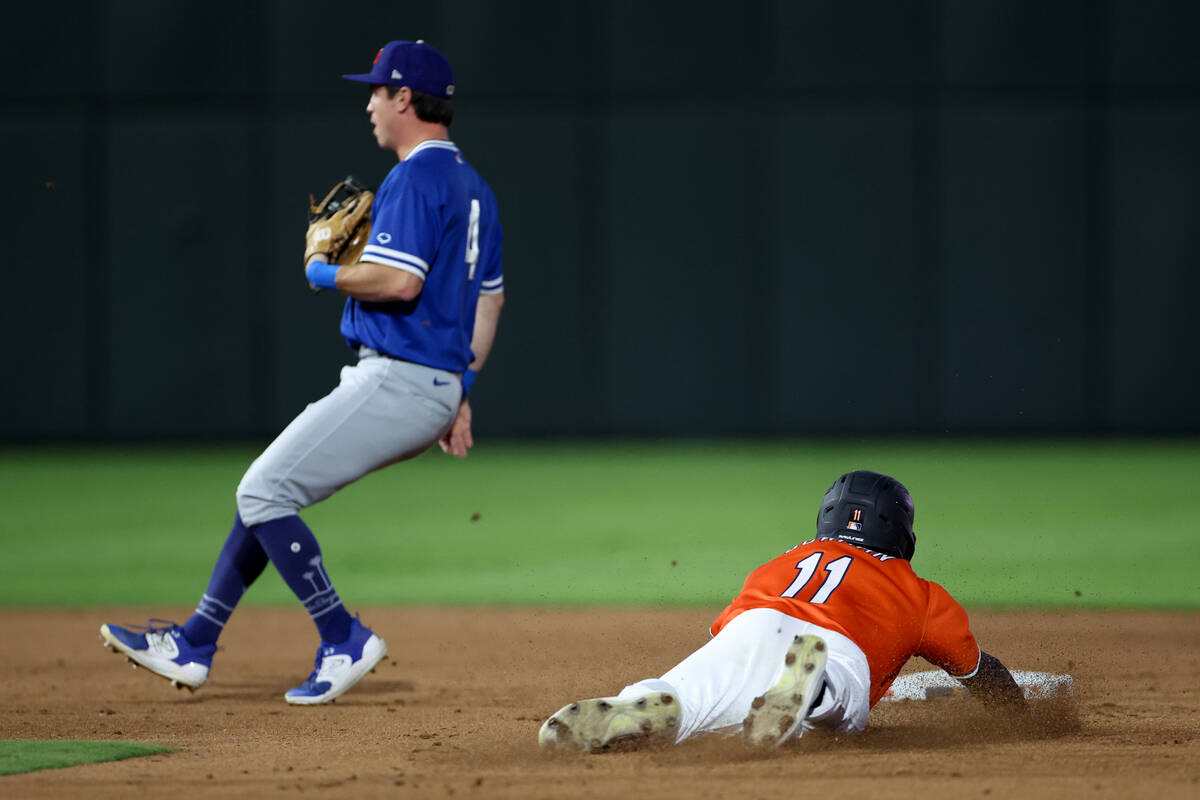 Las Vegas Aviators infielder Cooper Bowman (11) slides safely into second base while Oklahoma C ...