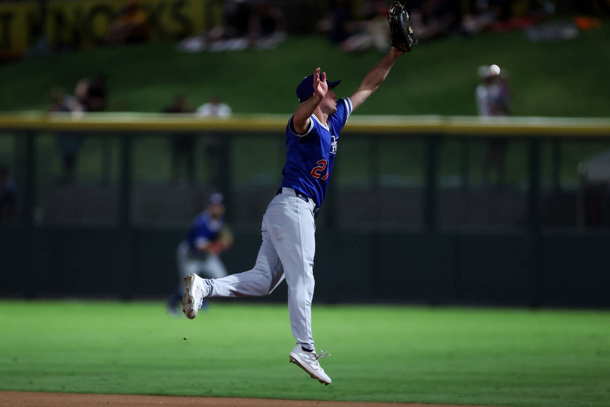 Oklahoma City Baseball Club infielder Andre Lipcius (27) misses a catch at first base during a ...