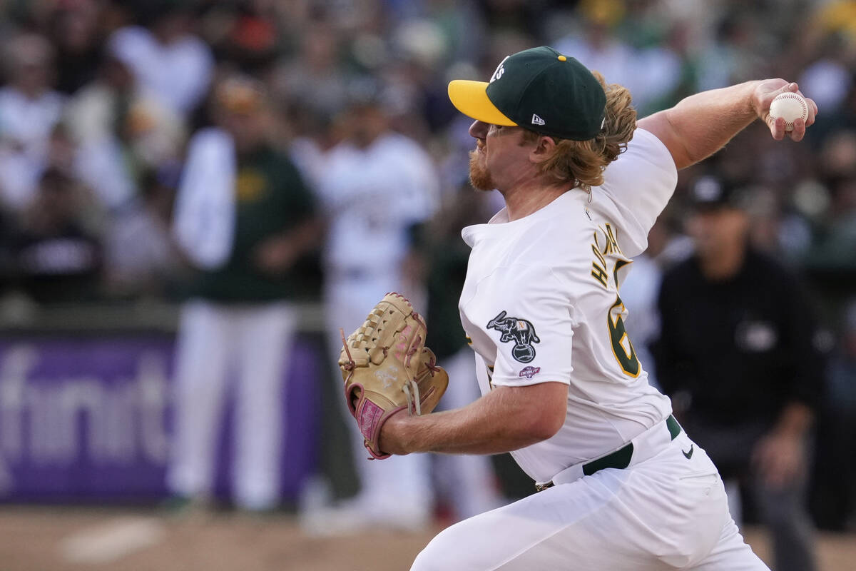 Oakland Athletics' Grant Holman pitches to a San Francisco Giants batter during the eighth inni ...