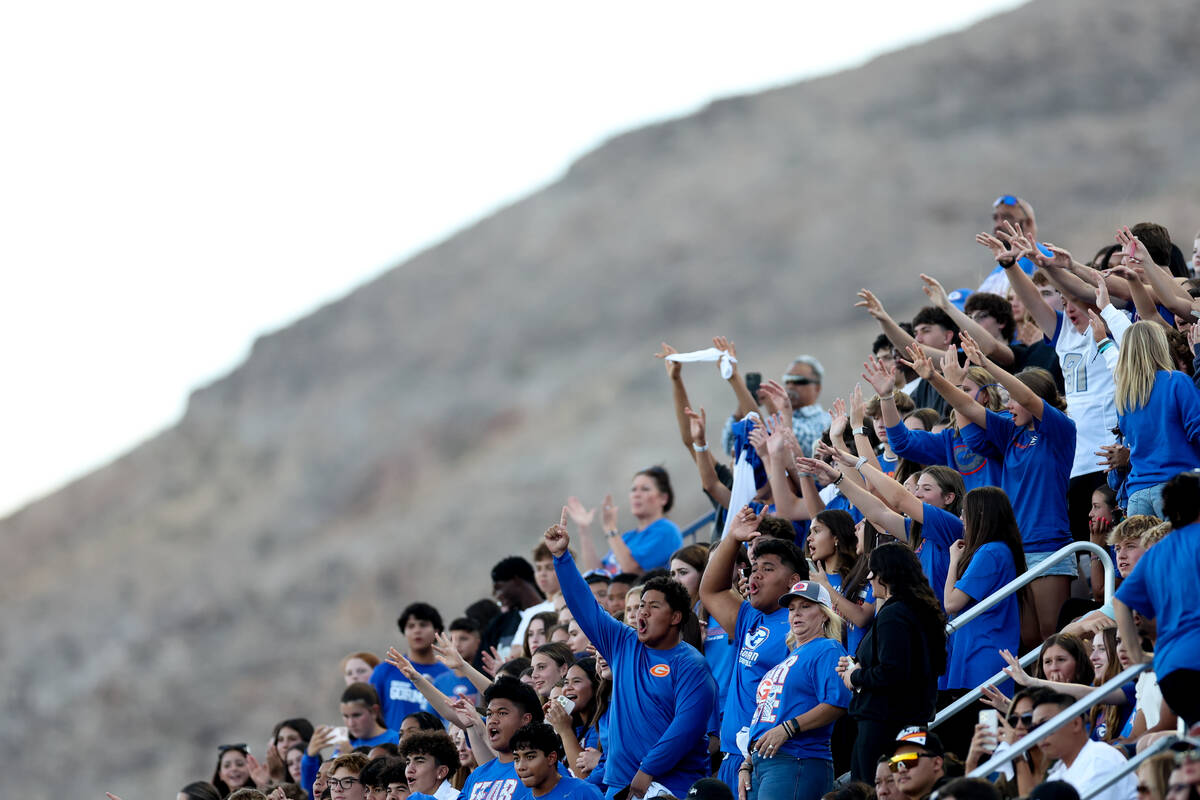 Bishop Gorman fans cheer during the first half of a high school football game against Kahuku on ...