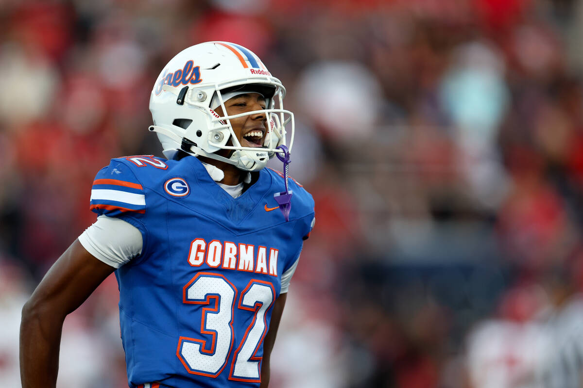 Bishop Gorman free safety Hayden Stepp (32) cheers after a play during the first half of a high ...