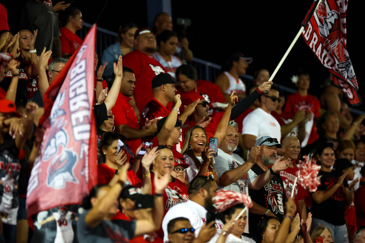 Kahuku cheers for its team during the second half of a high school football game against Bishop ...