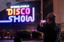 Spiegelworld founder Ross Mollison is shown taking video of the sign for "DiscoShow" at Linq Ho ...