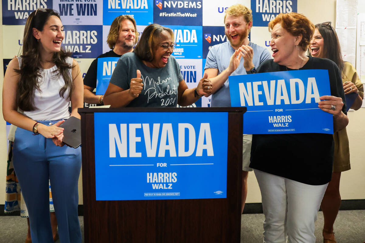 Nevada State Democratic Party Chairperson Daniele Monroe-Moreno speaks while surrounded by dele ...