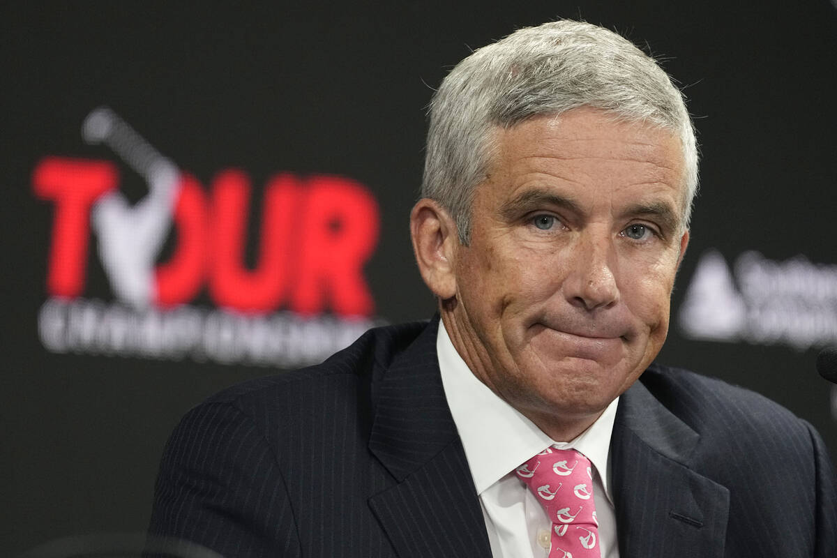 PGA Tour Commissioner Jay Monahan listens to a question during a press conference at East Lake ...