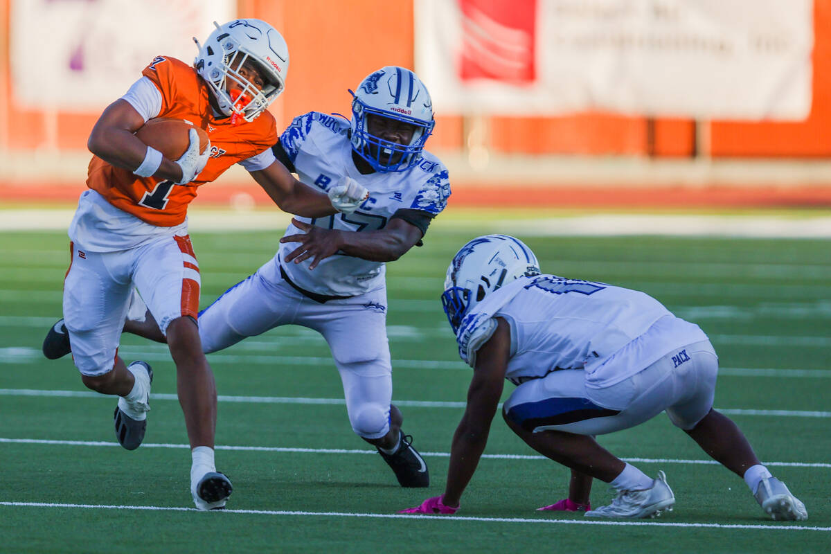 Legacy wide receiver Dominic Oliver (1) carries the ball to the end zone for a touchdown as he ...