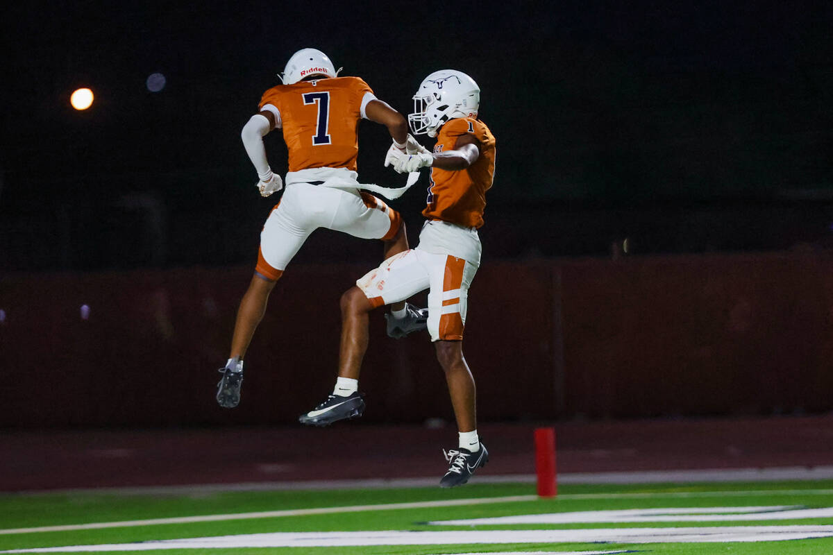 Legacy wide receivers Dominic Oliver (1) and Jordan Thompson-Woods celebrate a touchdown during ...