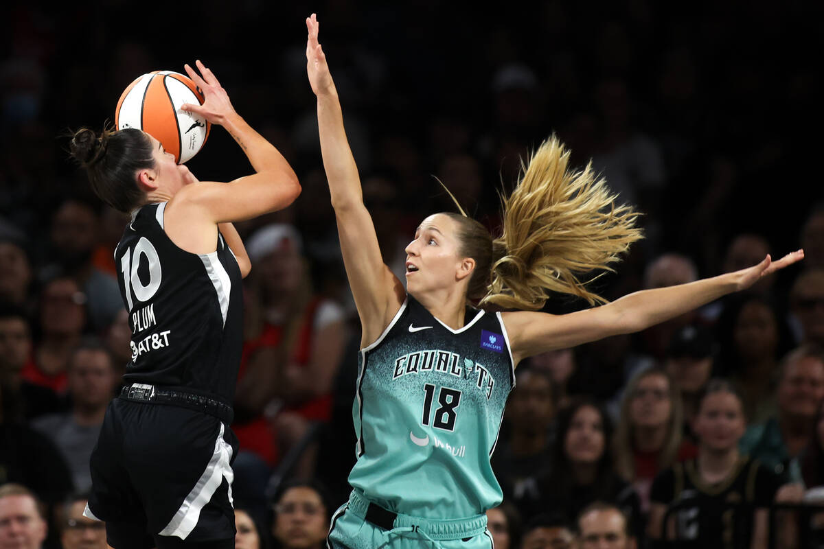 Las Vegas Aces guard Kelsey Plum (10) shoots against New York Liberty guard Ivana Dojkic (18) d ...