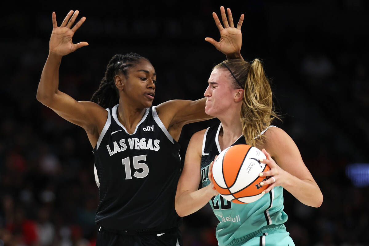 Las Vegas Aces guard Tiffany Hayes (15) defends against New York Liberty guard Sabrina Ionescu ...