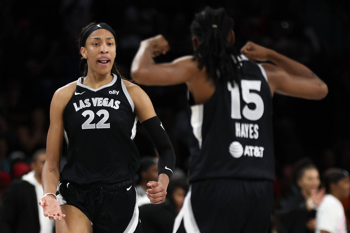 Las Vegas Aces center A'ja Wilson (22) and guard Tiffany Hayes (15) celebrate a score during th ...