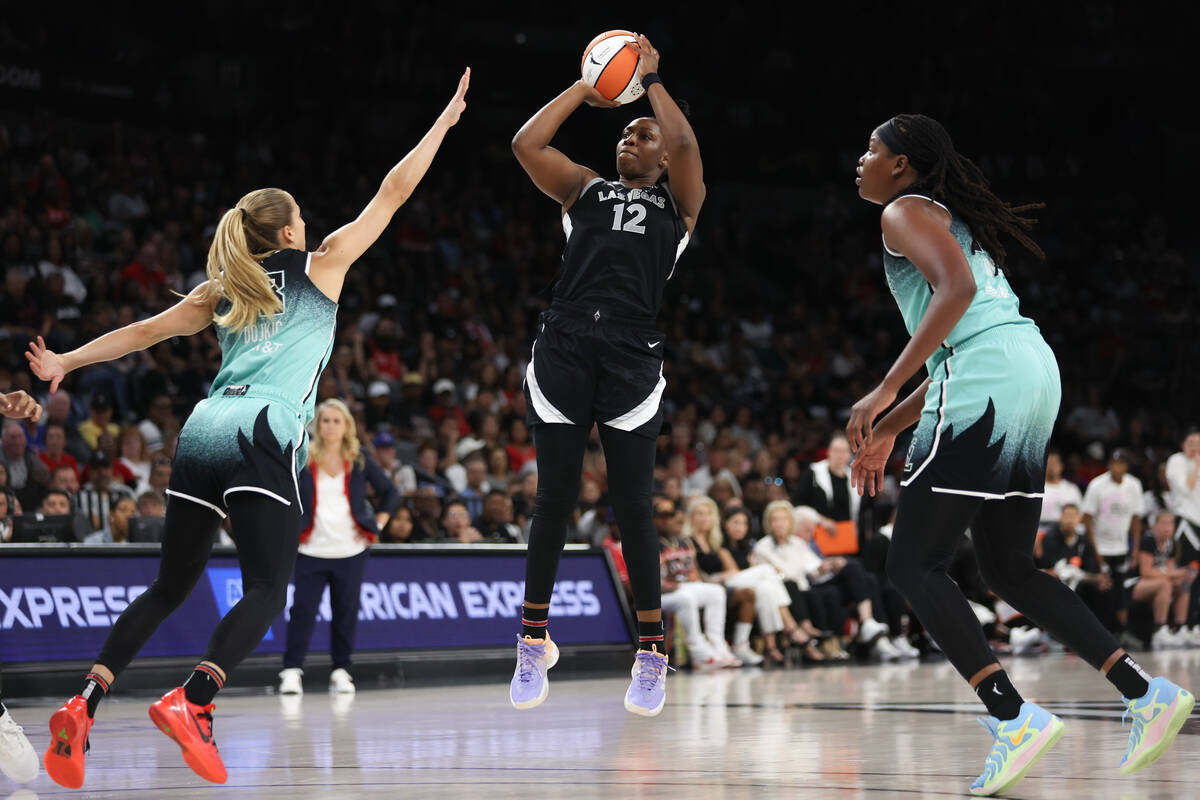 Las Vegas Aces guard Chelsea Gray (12) shoots against New York Liberty guard Ivana Dojkic (18) ...