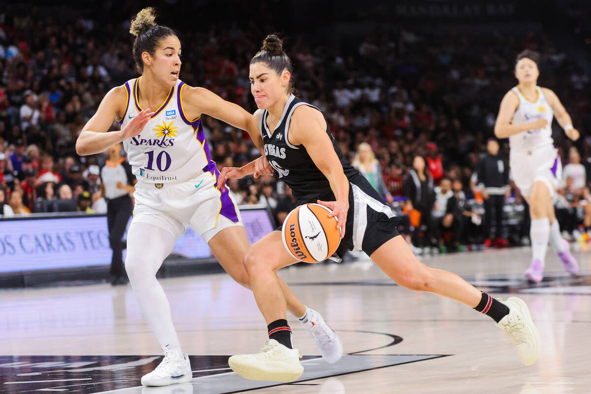 Los Angeles Sparks guard Kia Nurse (10) guards Aces guard Kelsey Plum (10) as she drives to th ...