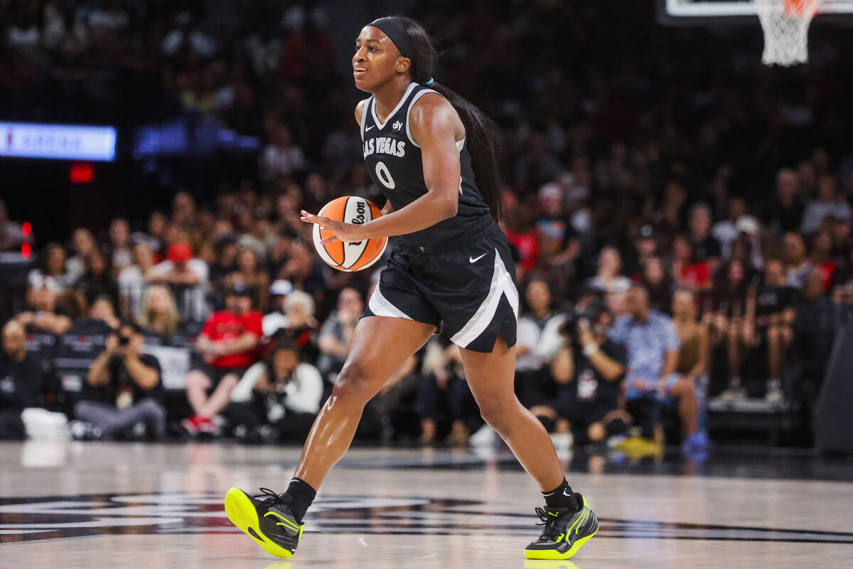 Aces guard Jackie Young (0) dribbles the ball down the court during a WNBA basketball game betw ...