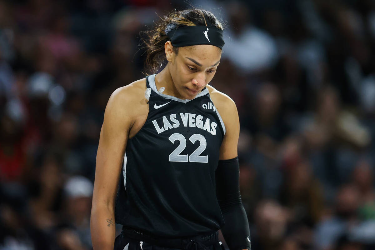 Aces center A'ja Wilson (22) takes a moment during a WNBA basketball game between the Aces and ...