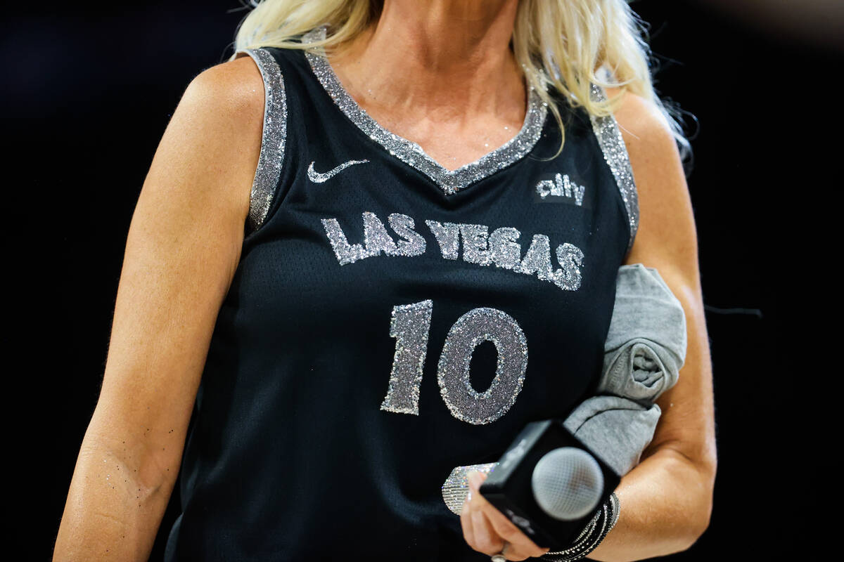 A bedazzled jersey worn by Las Vegas Aces emcee CJ Simpson is seen during a WNBA basketball gam ...