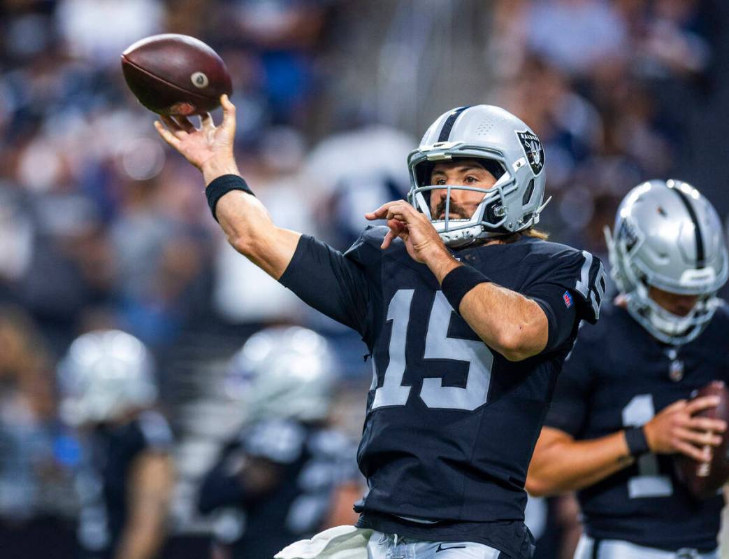 Raiders quarterback Gardner Minshew (15) gets off a pass during warm ups before the first half ...