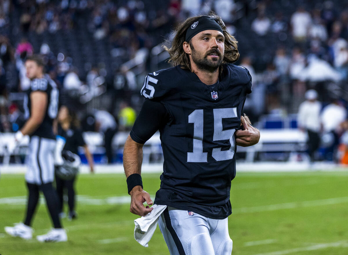 Raiders quarterback Gardner Minshew (15) runs off the field following their loss to the Dallas ...