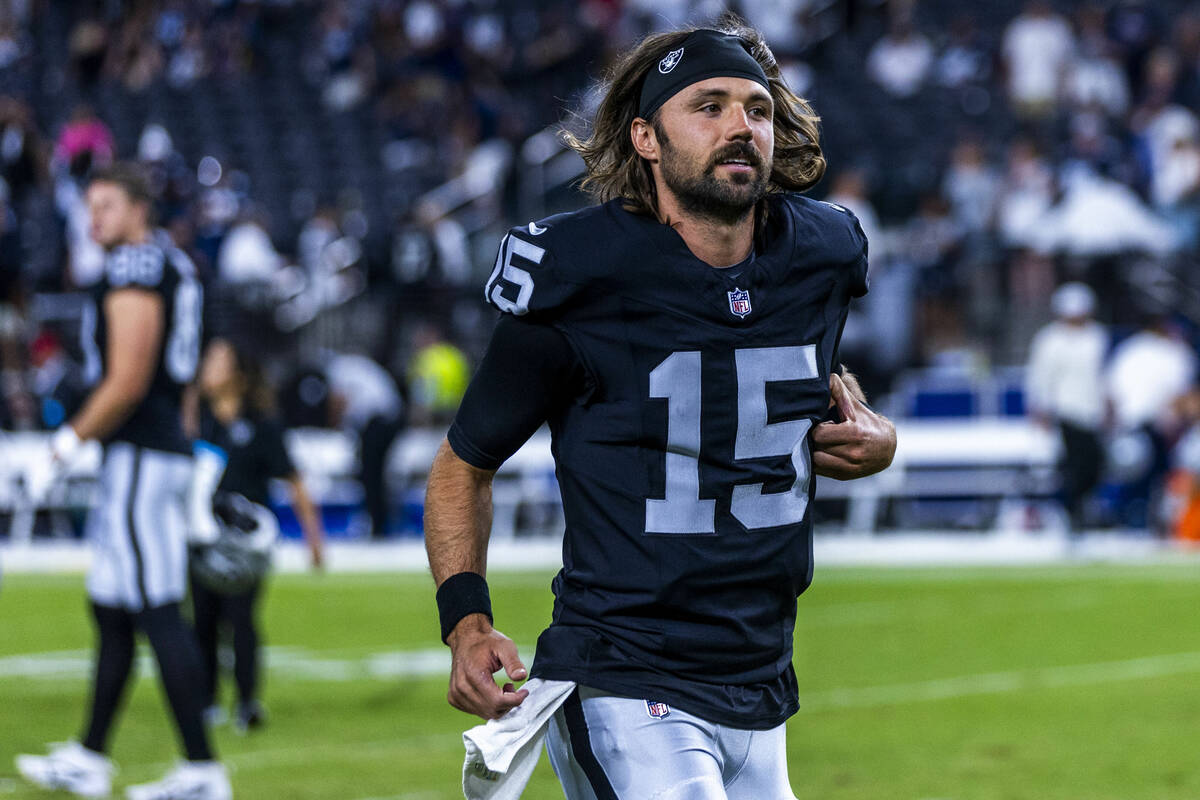 Raiders quarterback Gardner Minshew (15) runs off the field following their loss to the Dallas ...