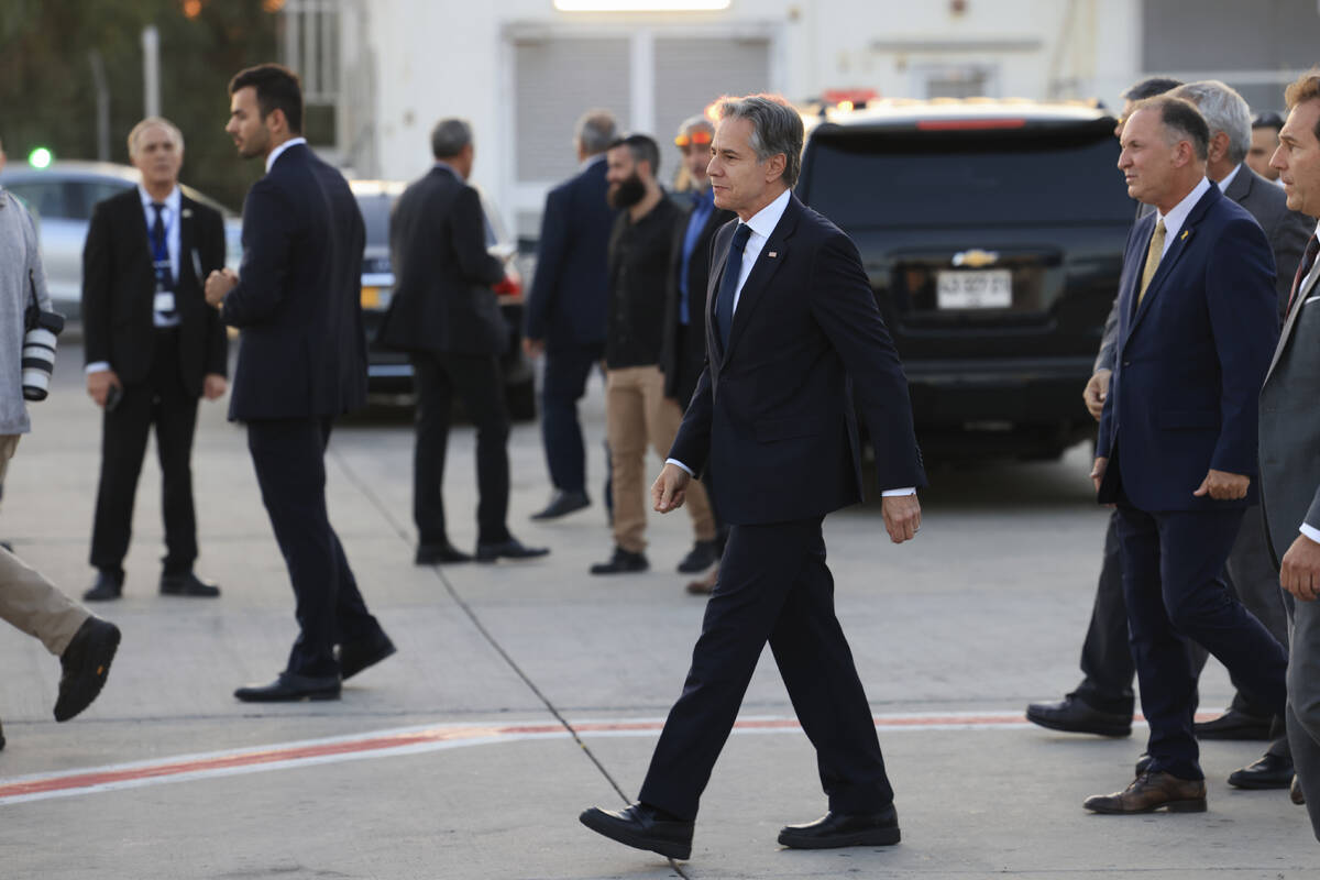 U.S. Secretary of State Antony Blinken walks after his arrival in Tel Aviv, Israel, Sunday, Aug ...