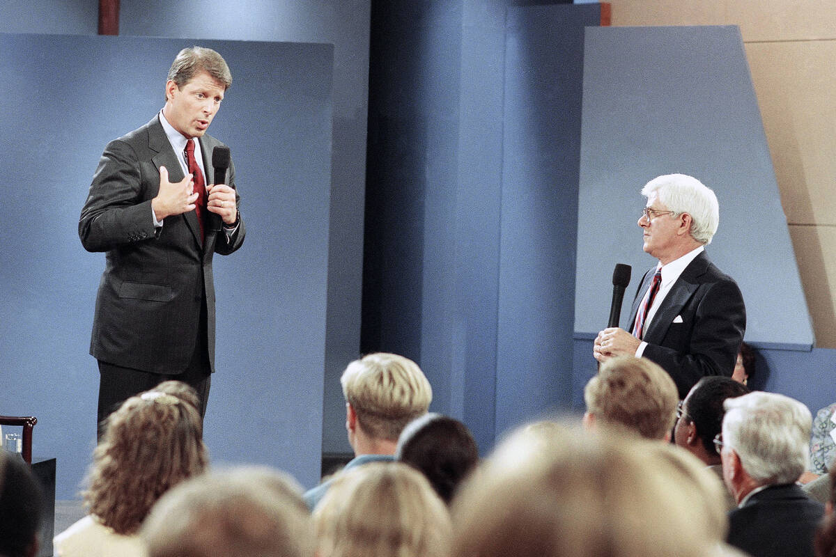 FILE - Vice President Al Gore, left, fields questions about his recommendations to reduce gover ...