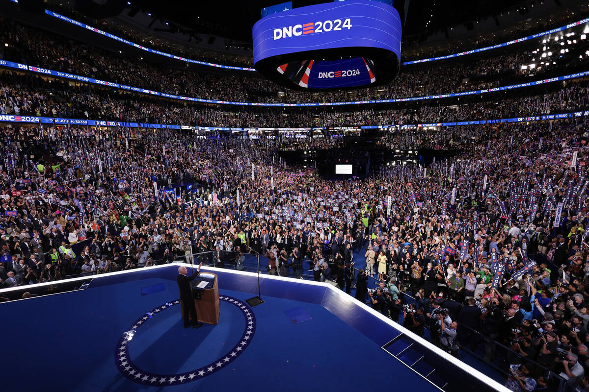 President Joe Biden waves to the crowd during the Democratic National Convention, Monday, Aug. ...