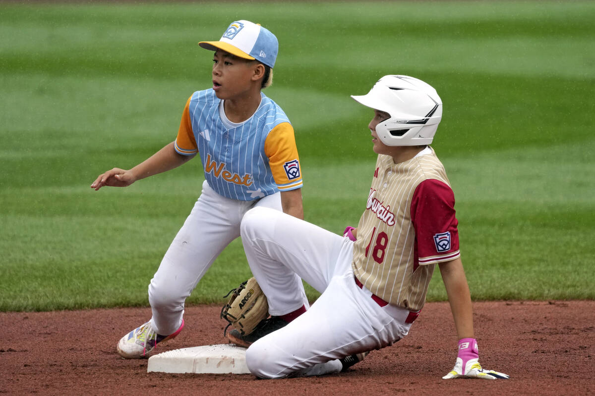 Henderson, Nev.'s Wyatt Erickson, right, slides into second base with a double ahead of a tag b ...