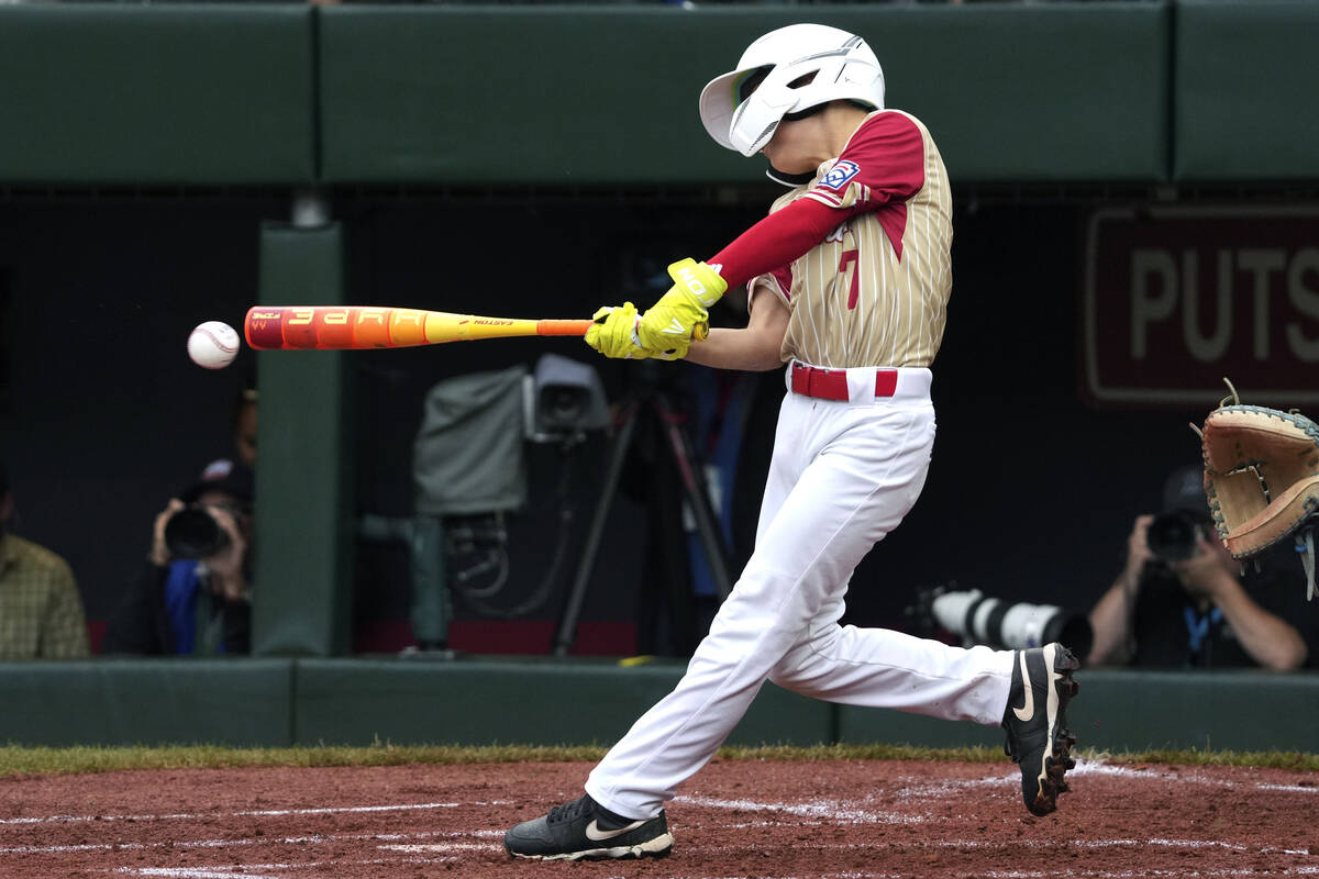 Henderson, Nev.'s Luke Lentz singles off Wailuku, Hawaii's Gauge Pacheco to drive in a run duri ...