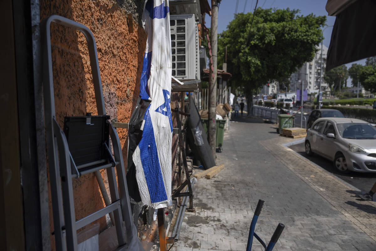 The street after a bomb explosion in Tel Aviv, Israel, Monday, Aug. 19, 2024. (AP Photo/Ohad Zw ...