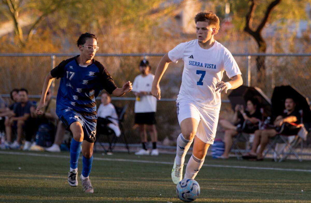 Sierra Vista midfielder Leon Mesic (7) and Basic senior Alex Cepriano (17) compete for the ball ...