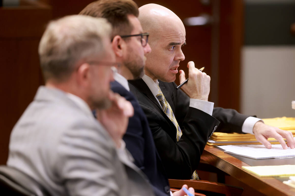 Robert Telles, right, listens to testimony of Matthew Hovanec, a Metropolitan Police Department ...