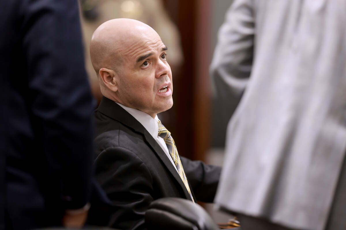 Robert Telles talks to his attorneys upon entering the courtroom after lunch break during his m ...