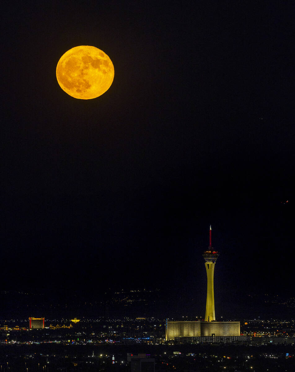 Monday’s blue moon is the third of the four full moons this summer. Is is seen over The Strat ...