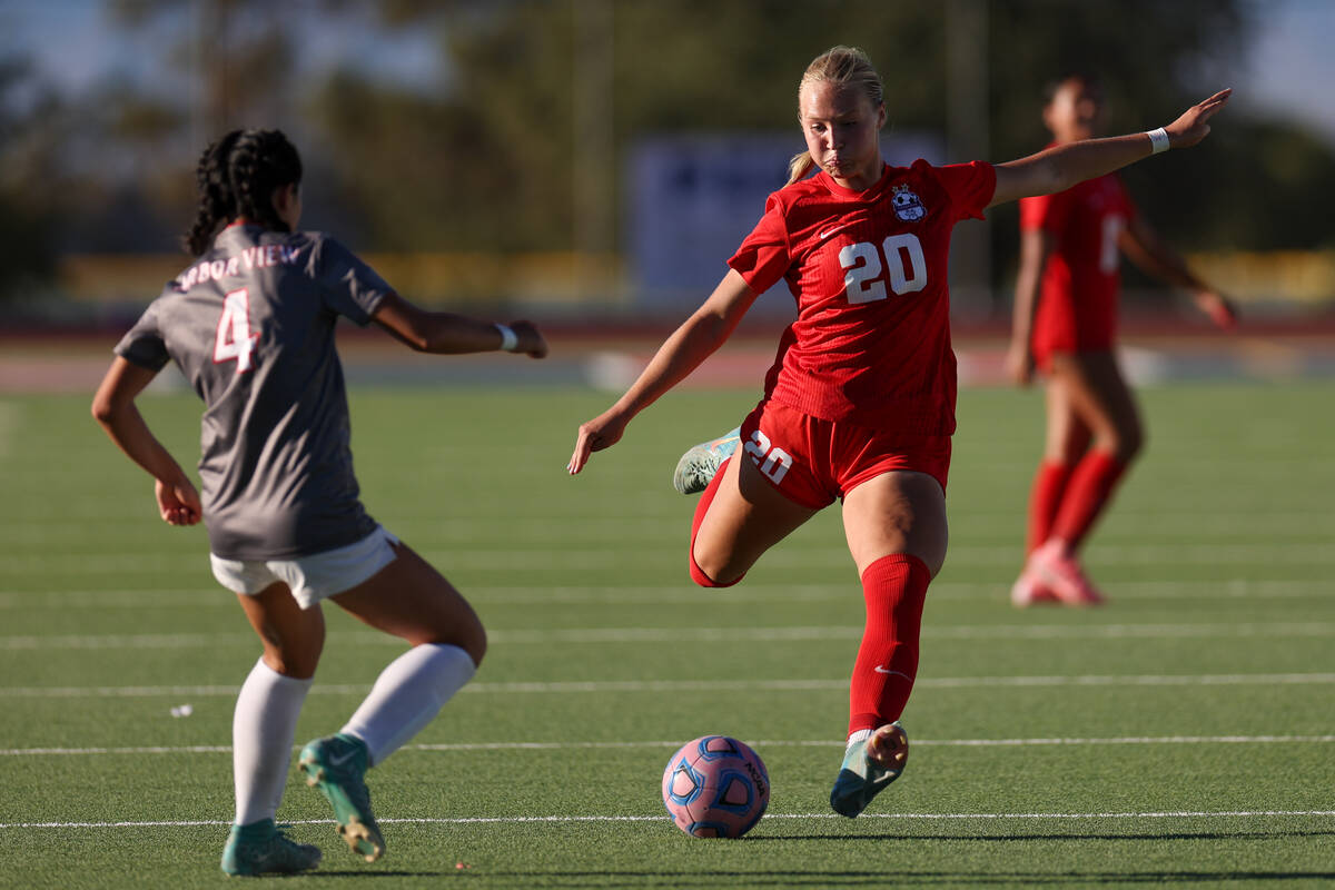 Coronado defender Cate Gusick winds up for a kick against Arbor View midfielder Sophia Sachs (4 ...