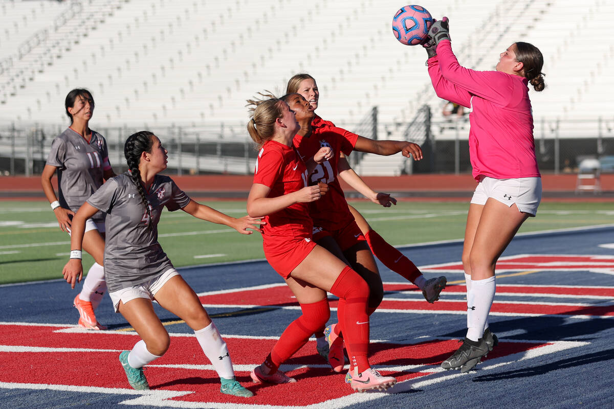 Arbor View goalkeeper Emily Marks, right, saves the ball against Coronado during a high school ...