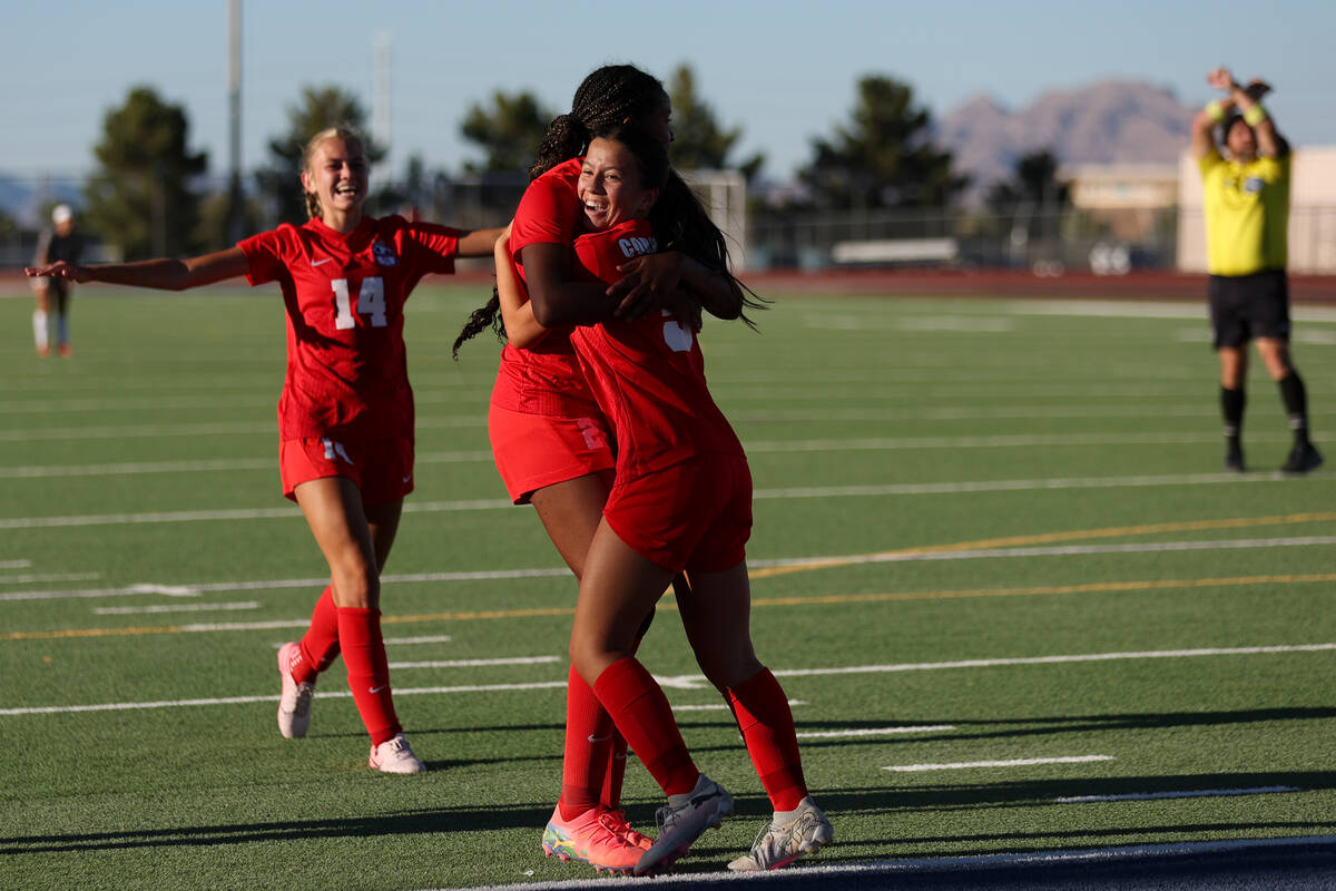 Coronado forward Abby Obregon, right, celebrates a goal with forward Jazmine McCallum, center, ...