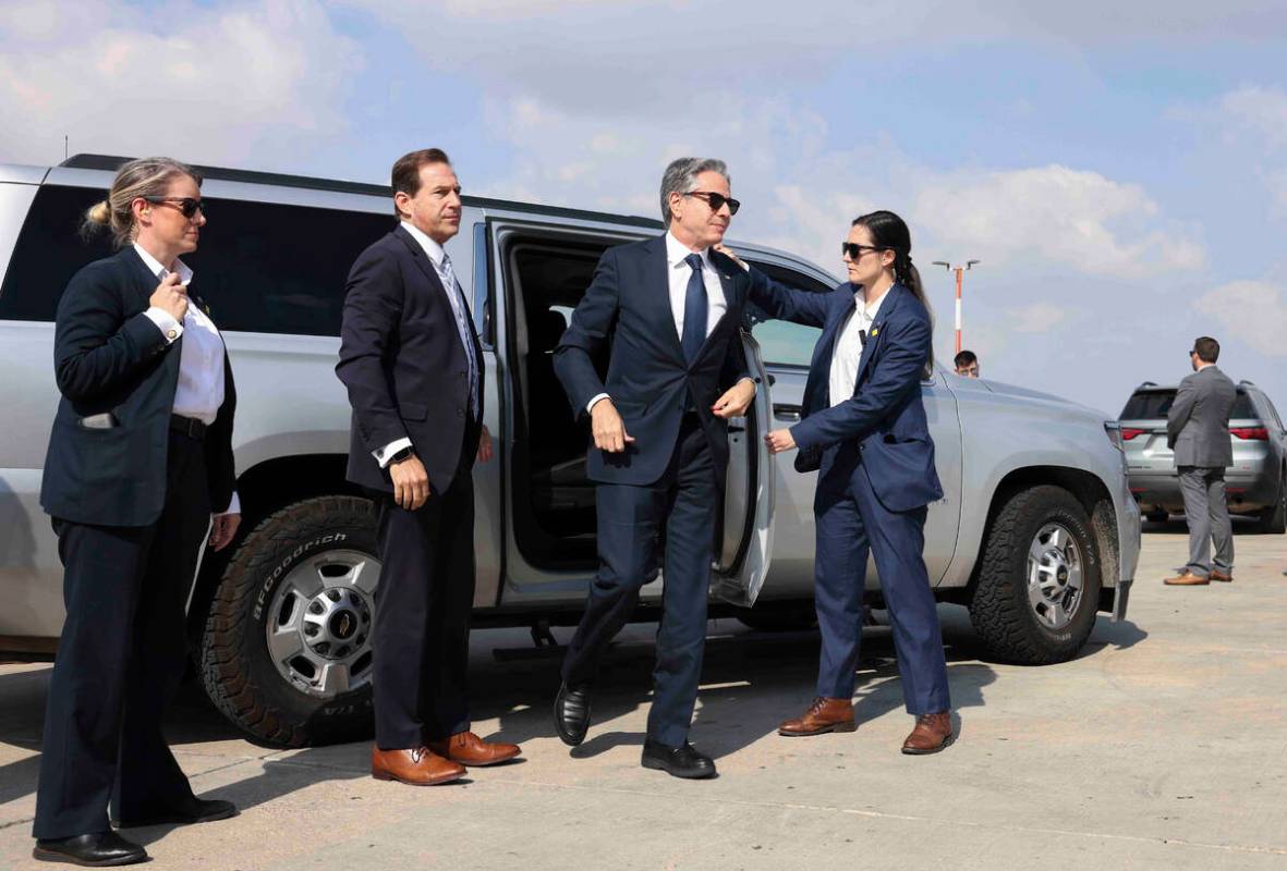 U.S. Secretary of State Antony Blinken steps out of a vehicle as he departs for Egypt, in Tel A ...