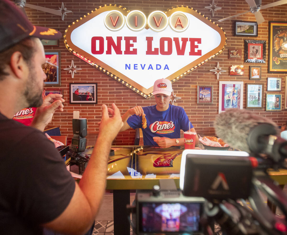 Olympic medalist Katie Grimes is directed specifically how to dunk a chicken finger into the sa ...