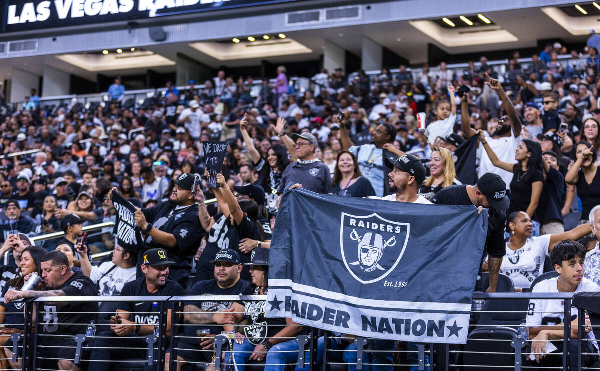 Raiders fans cheers for their team during an open practice at Allegiant Stadium on Tuesday, Aug ...