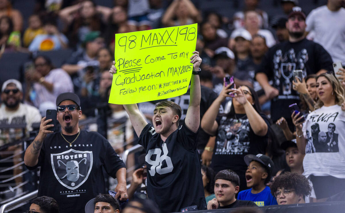 A Raiders fan wants to invite defensive end Maxx Crosby (98) to his graduation during an open p ...