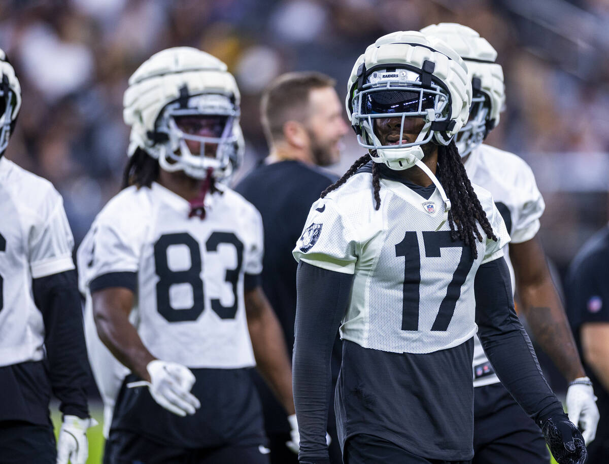 Raiders wide receiver Davante Adams (17) looks to teammates during an open practice at Allegian ...