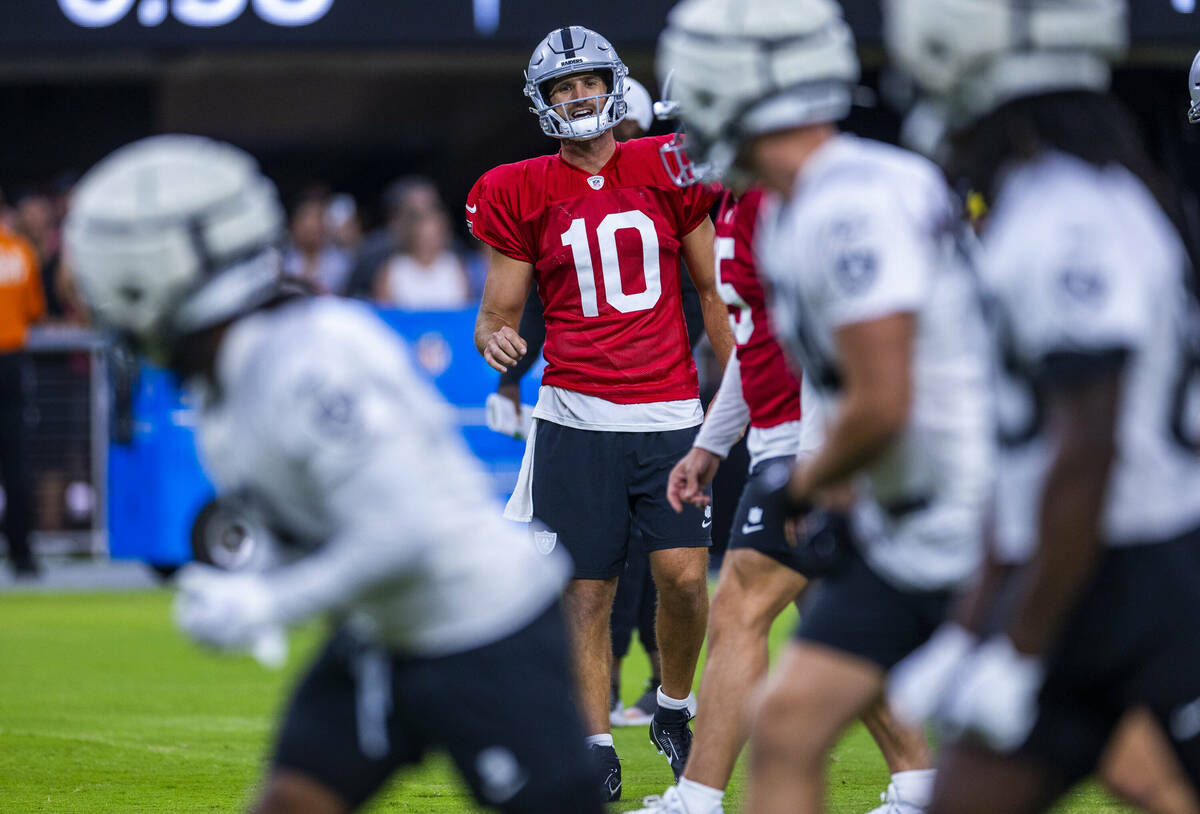 Raiders quarterback Nathan Peterman (10) yells to receivers during an open practice at Allegian ...