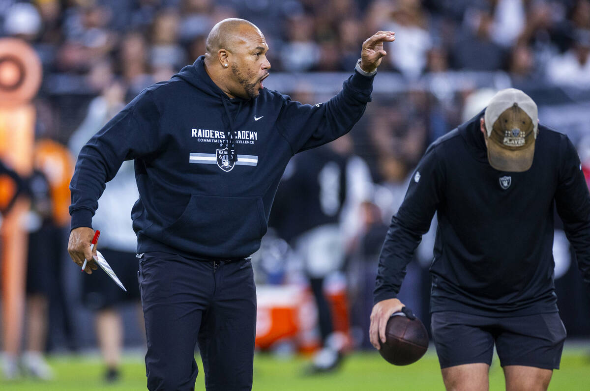 Raiders head coach Antonio Pierce directs players during an open practice at Allegiant Stadium ...