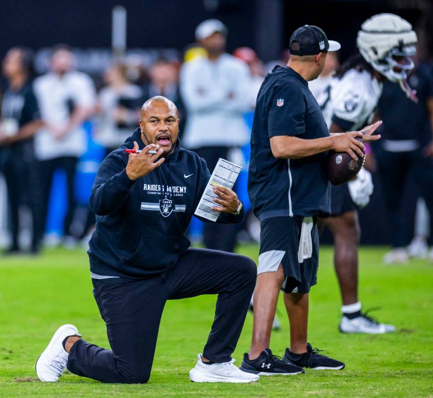 Raiders head coach Antonio Pierce directs players during an open practice at Allegiant Stadium ...