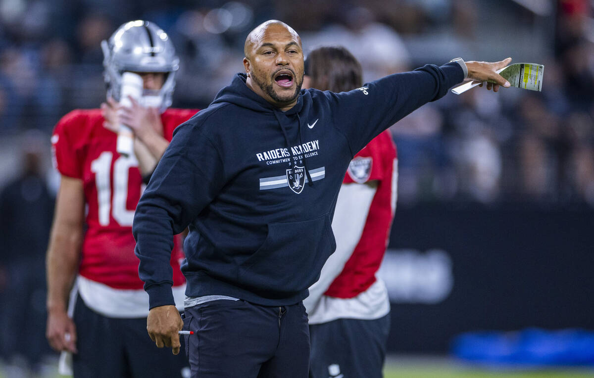 Raiders head coach Antonio Pierce directs players during an open practice at Allegiant Stadium ...