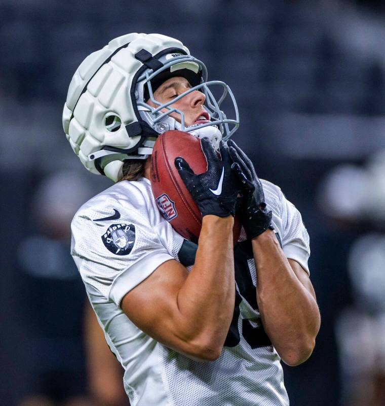 Raiders wide receiver Dax Milne (35) reaches out for a punt return during an open practice at A ...