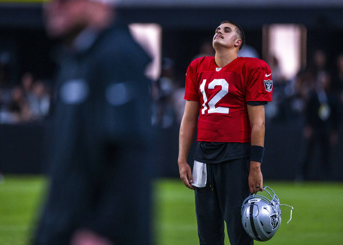 Raiders quarterback Aidan O'Connell (12) appears a bit dejected during an open practice at Alle ...