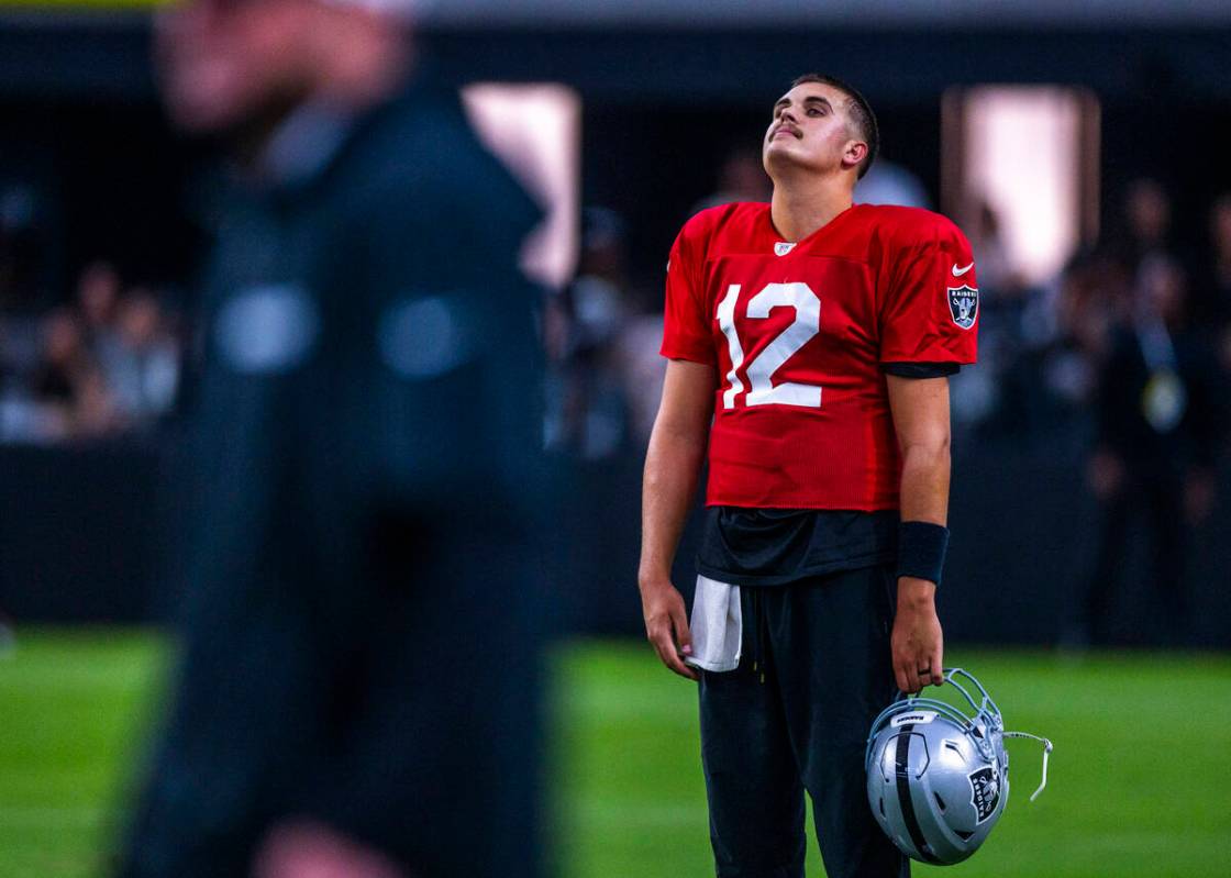 Raiders quarterback Aidan O'Connell (12) appears a bit dejected during an open practice at Alle ...