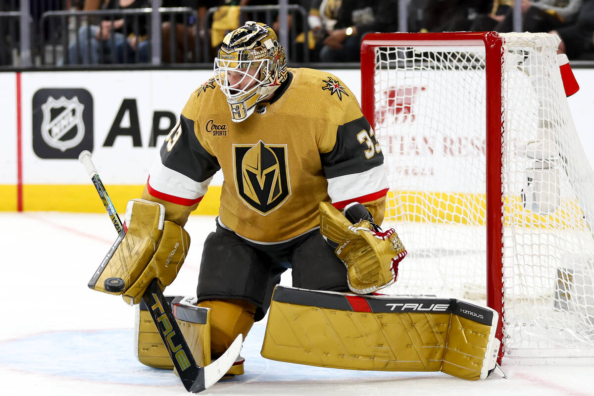 Golden Knights goaltender Adin Hill (33) saves the puck during the second period in Game 6 of a ...