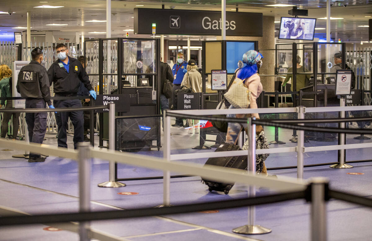 Travelers make their way through the TSA checkpoint at Terminal 1 at Harry Reid International A ...