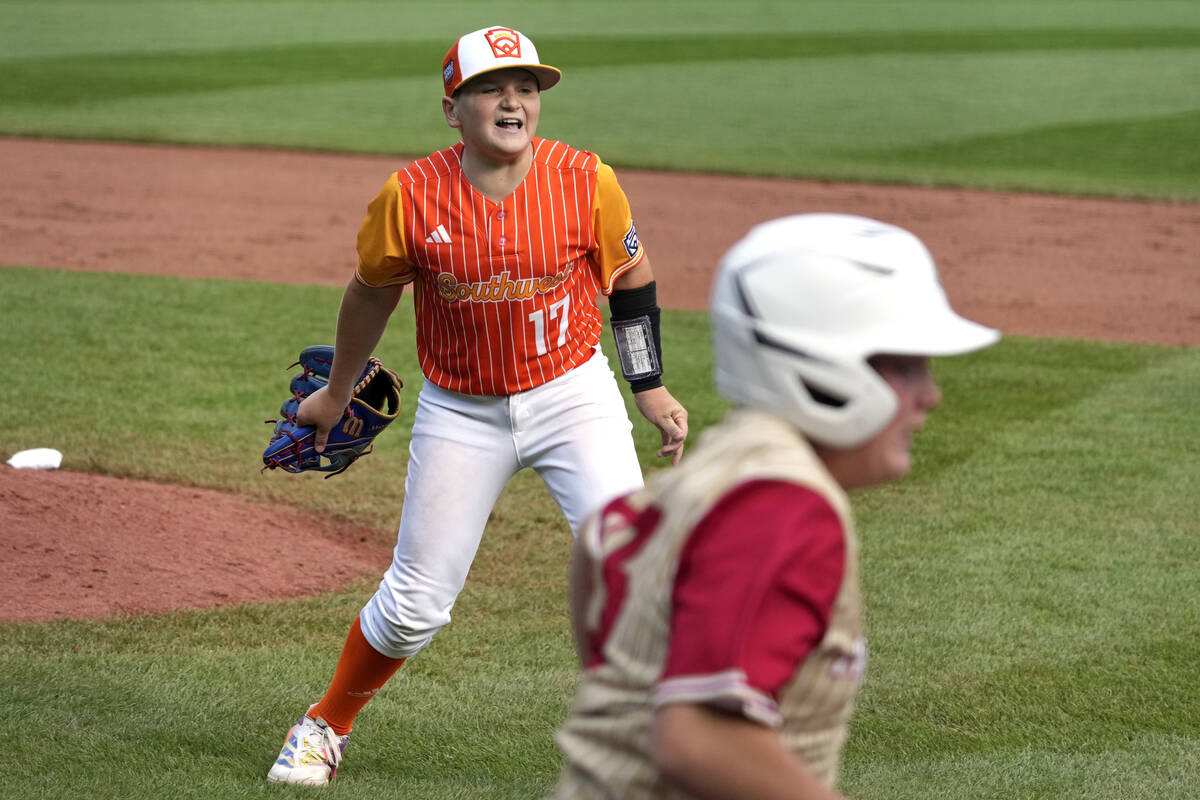 Boerne, Texas' Cooper Hastings (17) begins to celebrate after getting Henderson, Nev.'s Oliver ...